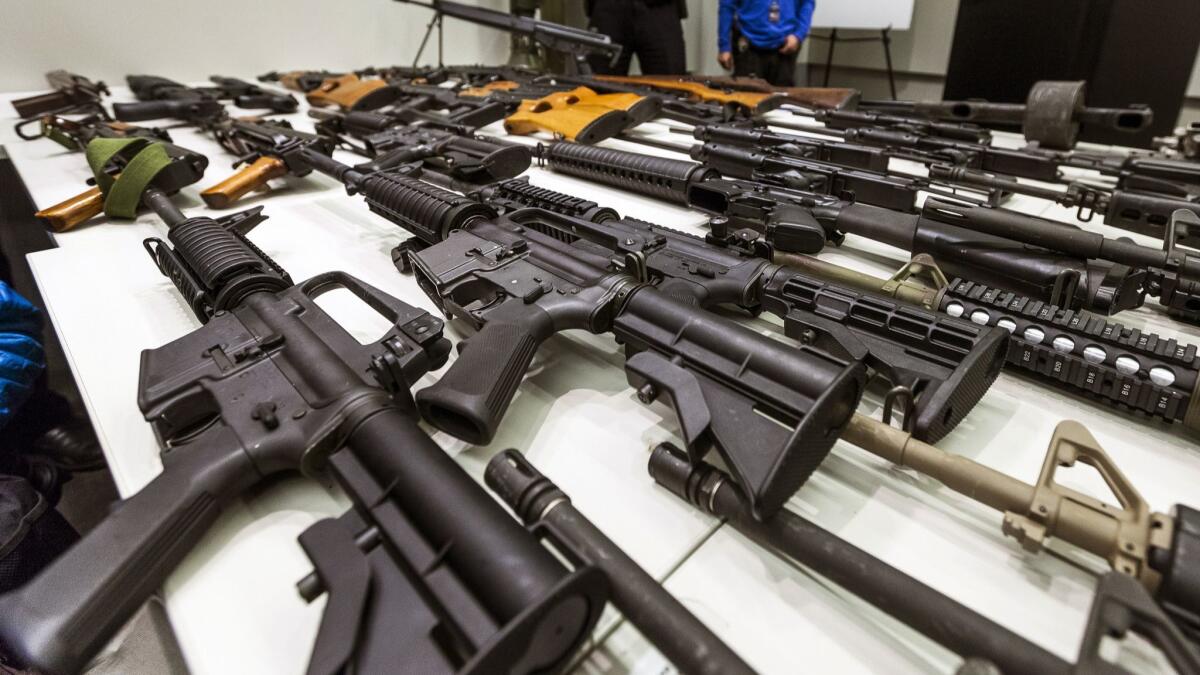 Glendale Police will host an anonymous gun buyback event on Oct. 27 in the Civic Center parking garage, 650 E. Wilson. In this 2012 photo, military-style semiautomatic rifles obtained during a buyback program are displayed at Los Angeles police headquarters.