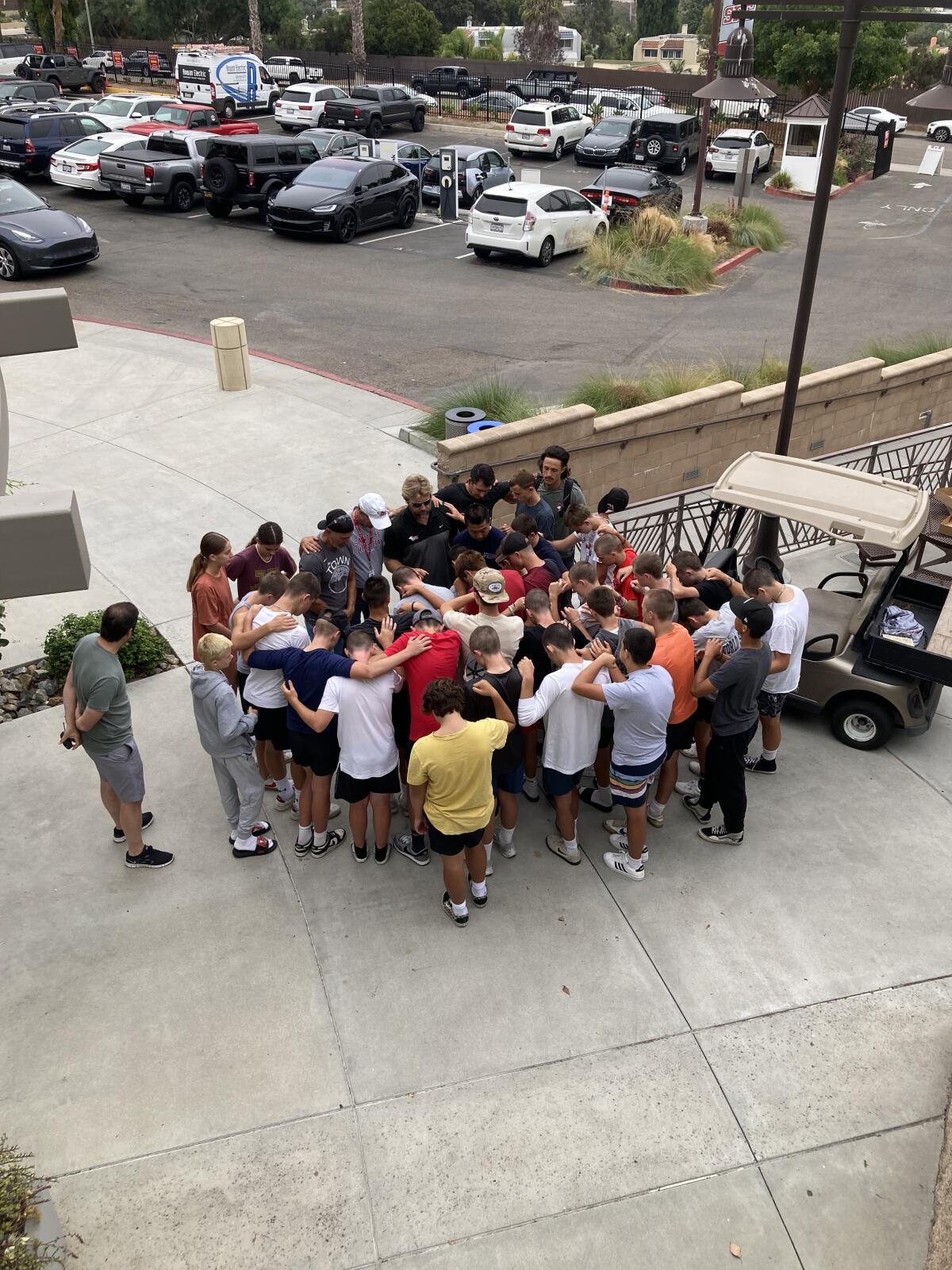 The JV football team met before painting to pray over the neighborhood.