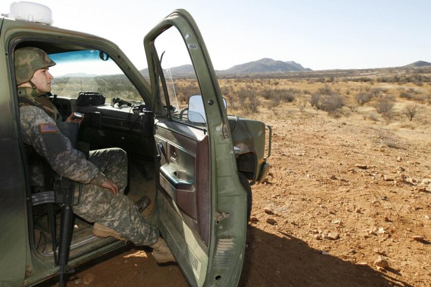 FILE - In this Friday, Jan. 19, 2007 file photo, a National Guard unit patrols at the Arizona-Mexico border in Sasabe, Ariz. President Donald Trump said April 3, 2018, he wants to use the military to secure the U.S.-Mexico border until his promised border wall is built. The Department of Homeland Security and White House did not immediately respond to requests for comment. At the Pentagon, officials were struggling to answer questions about the plan, including rudimentary details on whether it would involve National Guard members, as similar programs in the past have done. But officials appeared to be considering a model similar to a 2006 operation in which former President George W. Bush deployed National Guard troops to the southern border in an effort to increase security and surveillance.(AP Photo/Ross D. Franklin, file)