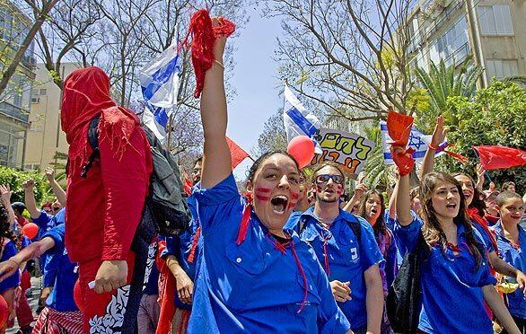 Israeli members of the Hanoar Haoved Vehalomed movement, a youth and student group, shout slogans as they march from Rabin Square to the Histadrut, Israel's General Federation of Labour, in Tel Aviv to mark Labour Day. May Day, a public holiday in many countries, has long celebrated the social and economic achievements of labor movements.