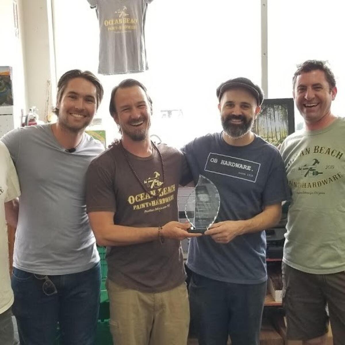 Miles Himmel, Mike DeEmedio, Michael Grimes and Jon Carr pose with the Himmel Foundation Good Neighbor Award, July 13.