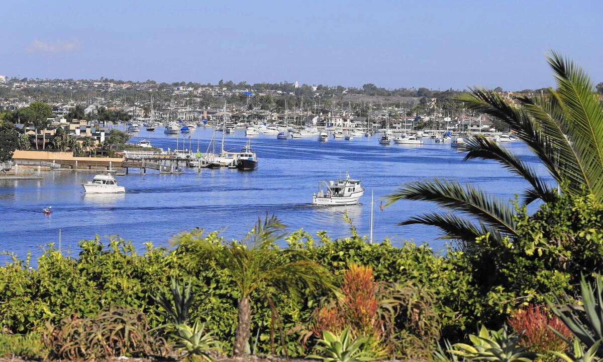Boaters navigate Newport Harbor in Newport Beach. In an effort to ease crowding during the busy summer boating season, the Harbor Commission recommended in 2015 that the city test a second anchorage.