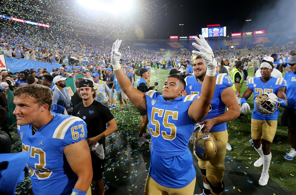 The UCLA Bruins football team leaves the field after beating LSU 38-27 at the Rose Bowl on Sept. 1, 2021. 