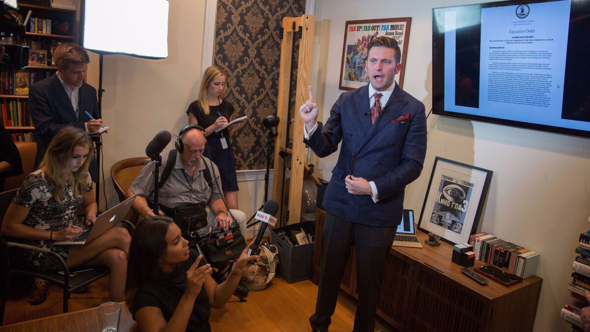 White nationalist Richard Spencer speaks to select media in his office space on Aug. 14, 2017, in Alexandria, Va.