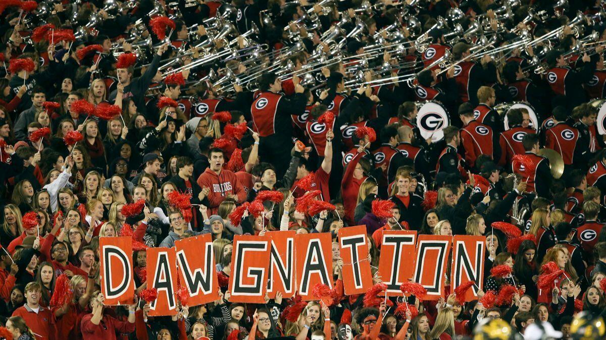 Georgia students and band in the stands in Athens, Ga., at last year's game against Missouri. The first-regular season meeting between Georgia and Notre Dame in South Bend, Ind., on Saturday is the most-anticipated road trip the Bulldogs have made in decades.
