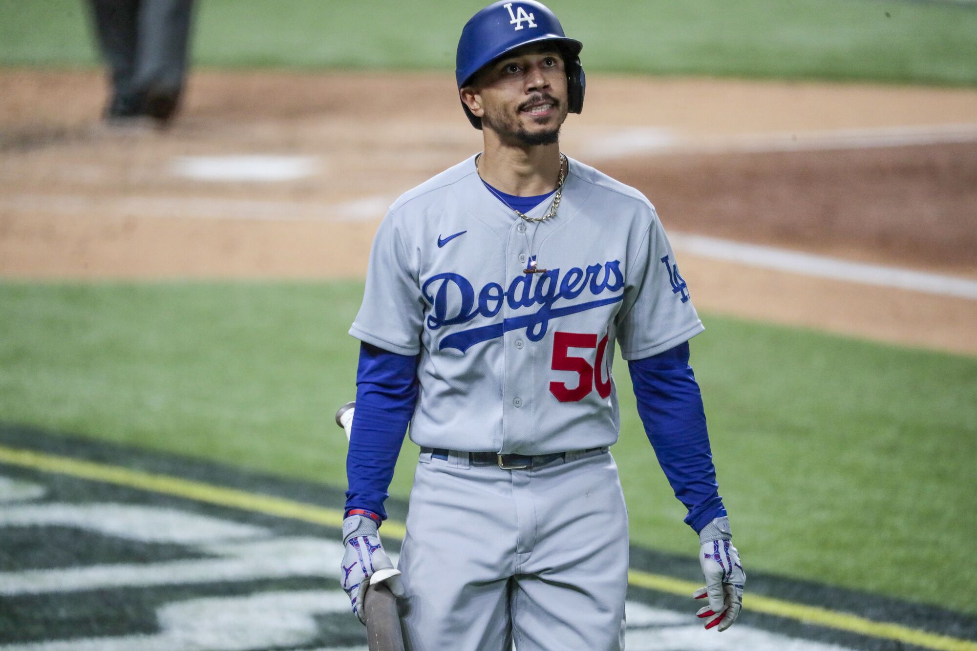 Dodgers right fielder Mookie Betts reacts after striking out in the third inning.