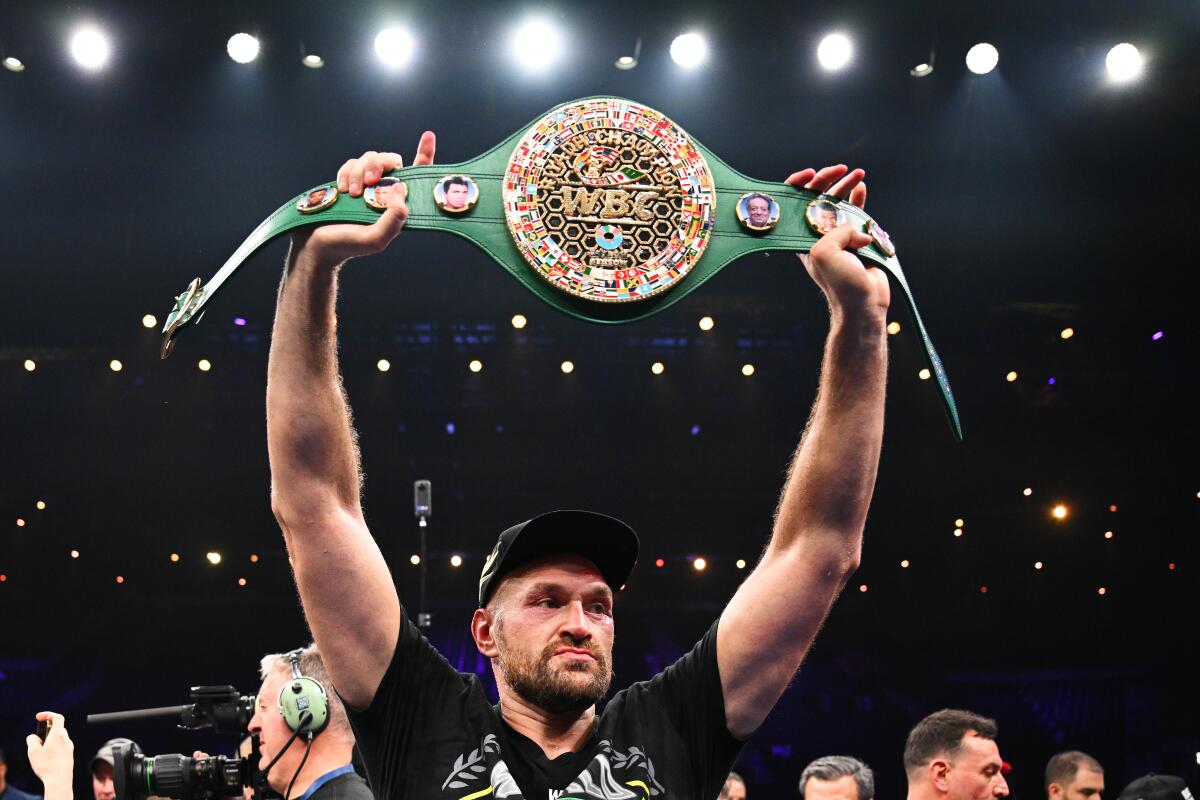Tyson Fury holds up his WBC World Heavyweight belt after beating Francis Ngannou on Oct. 28, 2023, in Saudi Arabia.