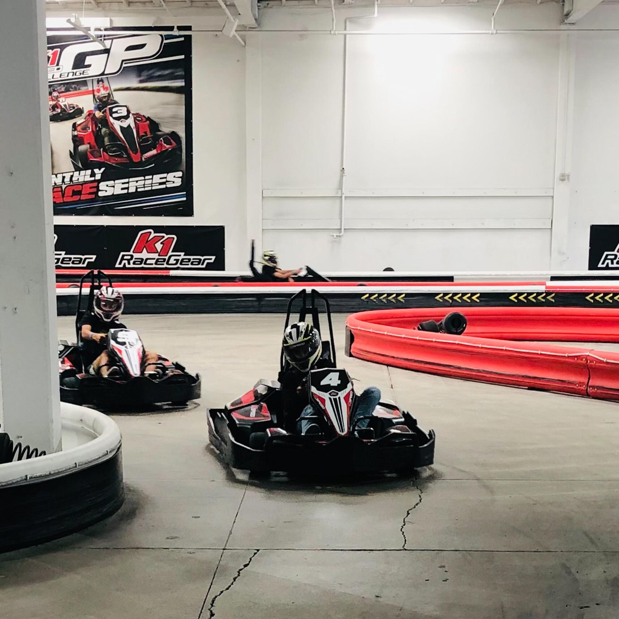 Go-karts racing indoors.