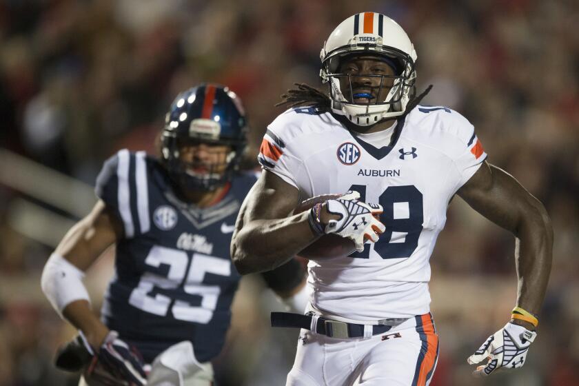 Auburn wide receiver Sammie Coates outruns Mississippi defensive back Cody Prewitt to score on a 57-yard pass from quarterback Nick Marshall in Oxford, Miss., on Saturday.