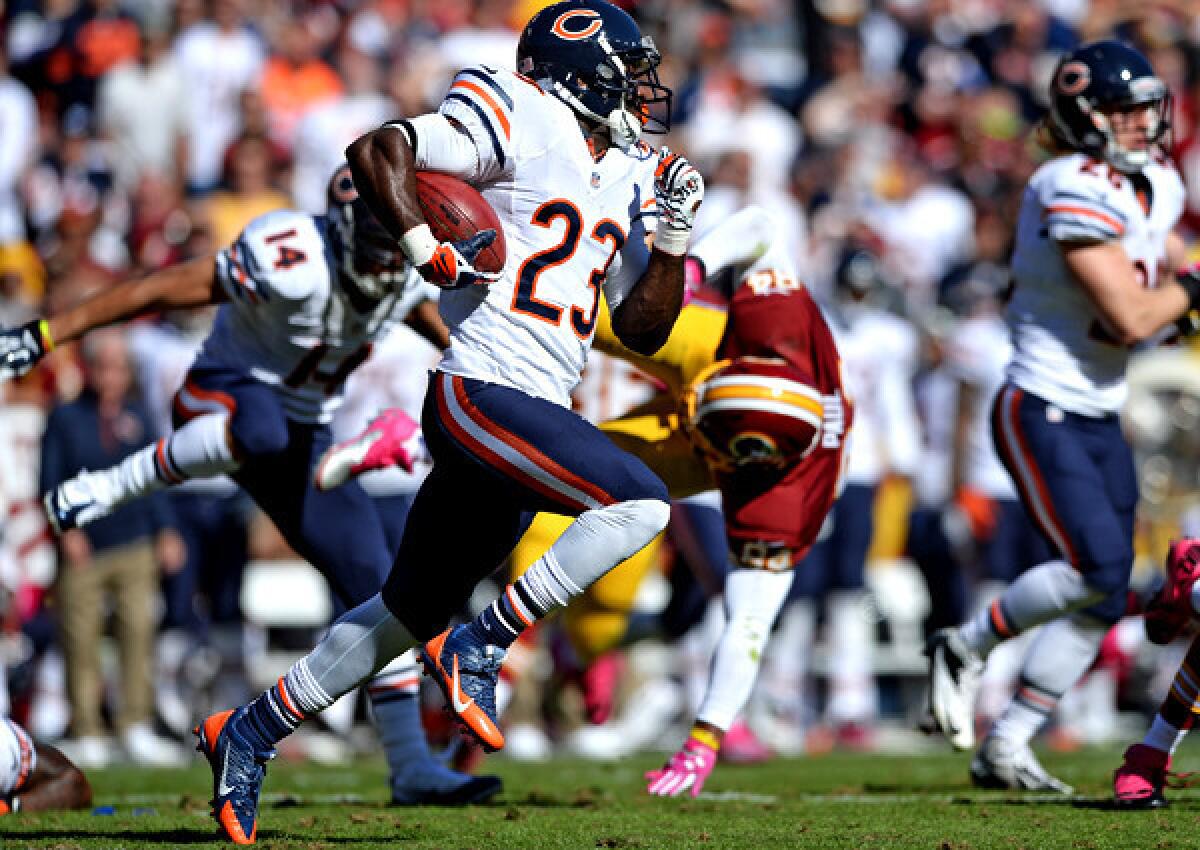 Bears receiver Devin Hester returns a punt 81 yards for a touchdown against the Washington Redskins in the second quarter at FedExField on Sunday, extending his NFL record to 13 punt returns for touchdowns.
