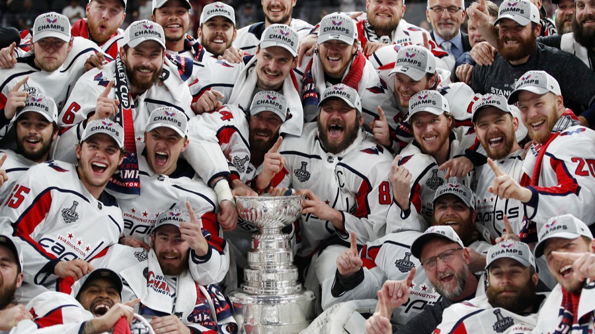 Members of the Washington Capitals pose with the Stanley Cup after the Capitals defeated the Golden Knights 4-3 in Game 5 of the Stanley Cup Finals on June 7 in Las Vegas.