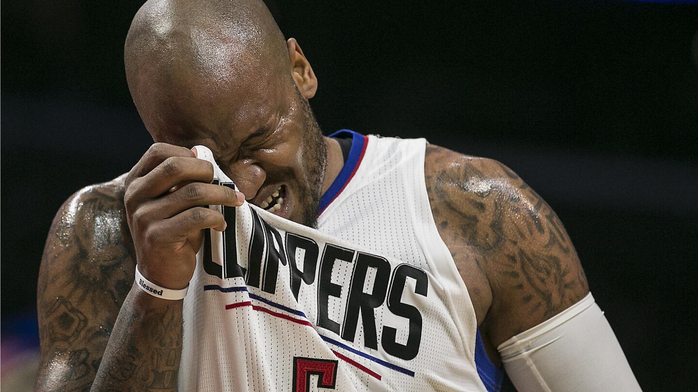 Clippers center Marreese Speights wipes sweat from his brow as he helps the Clippers overcome a third quarter deficit.