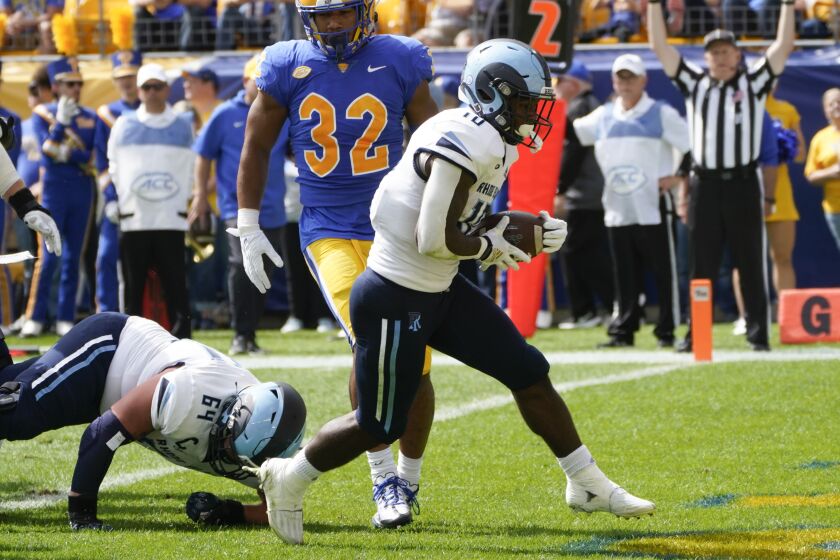 Rhode Island running back Marques DeShields (10) takes a handoff into the end zone for a touchdown against Pittsburgh during the first half of an NCAA college football game, Saturday, Sept. 24, 2022, in Pittsburgh. (AP Photo/Keith Srakocic)