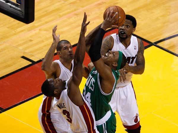 Paul Pierce #34 of the Boston Celtics goes up for a shot between Dwyane Wade #3 and Shane Battier #31 of the Miami Heat in the first quarter in Game Seven of the Eastern Conference Finals in the 2012 NBA Playoffs on June 9, 2012 at American Airlines Arena in Miami, Florida.