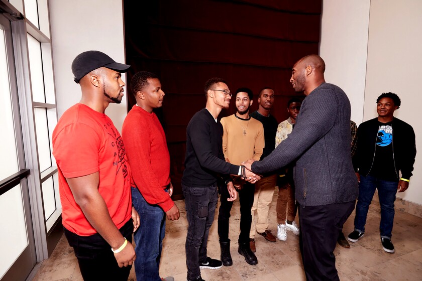 Kobe Bryant meets with audience members as part of his appearance at an April 2018 forum on the USC campus.