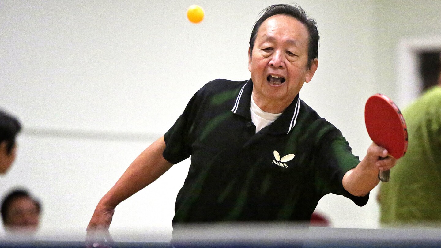 Andy Phan, 76, plays table tennis at Langley Senior Center in Monterey Park. Phan is an aggressive player and his nickname among other players is "Tornado."