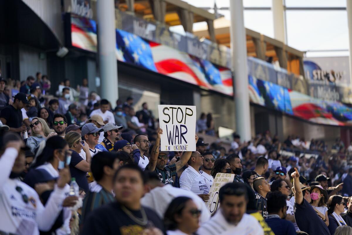 A fan holds up a sign supporting Ukraine during the Galaxy match against New York City FC 