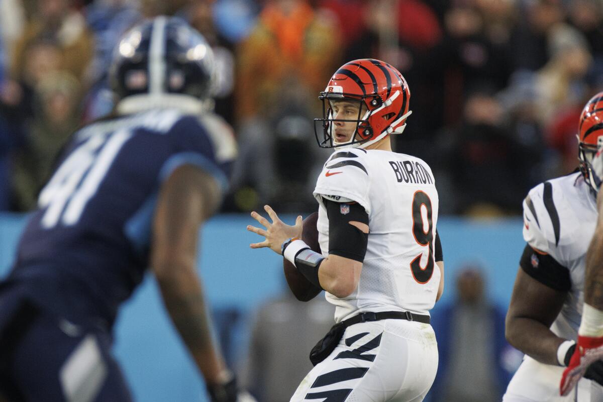 Bengals quarterback Joe Burrow drops back to pass against the Tennessee Titans in the playoffs.