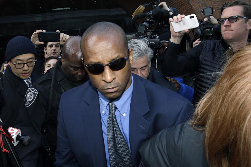 Rudy Meredith, former Yale women's soccer coach, departs federal court in Boston on Thursday, March 28, 2019, where he pleaded guilty to charges in a nationwide college admissions bribery scandal. (AP Photo/Steven Senne)