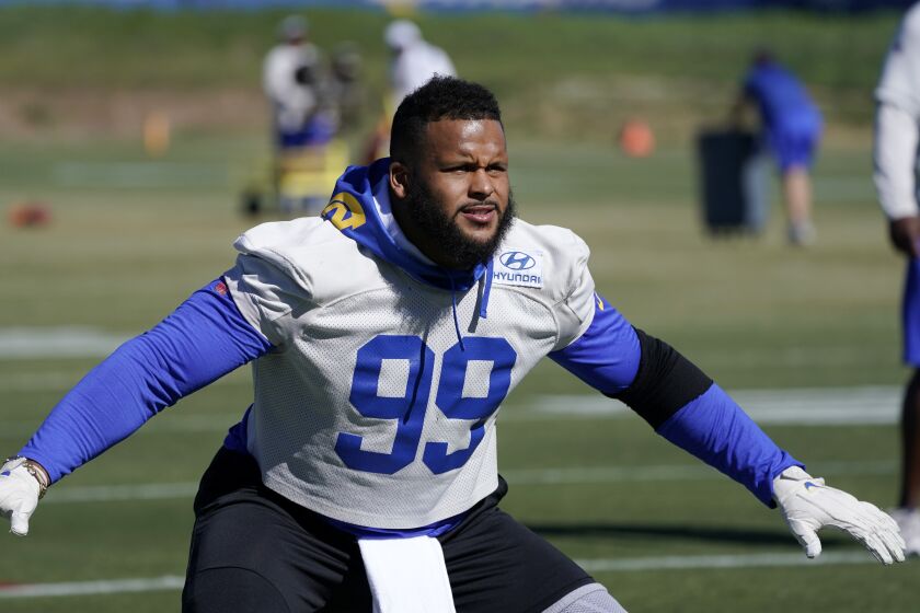Los Angeles Rams defensive end Aaron Donald runs a drill during practice for an NFL Super Bowl.