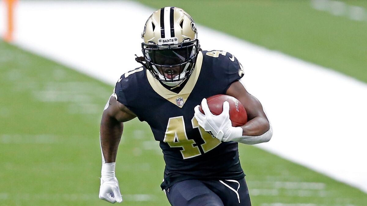 Saints back Alvin Kamara (41) runs upfield with the football.