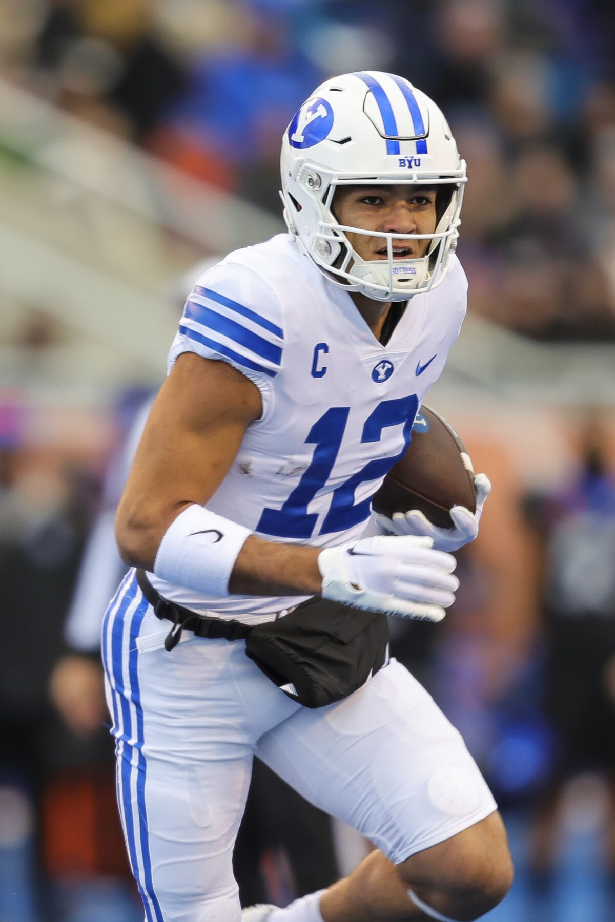 Brigham Young wide receiver Puka Nacua (12) runs after a catch.