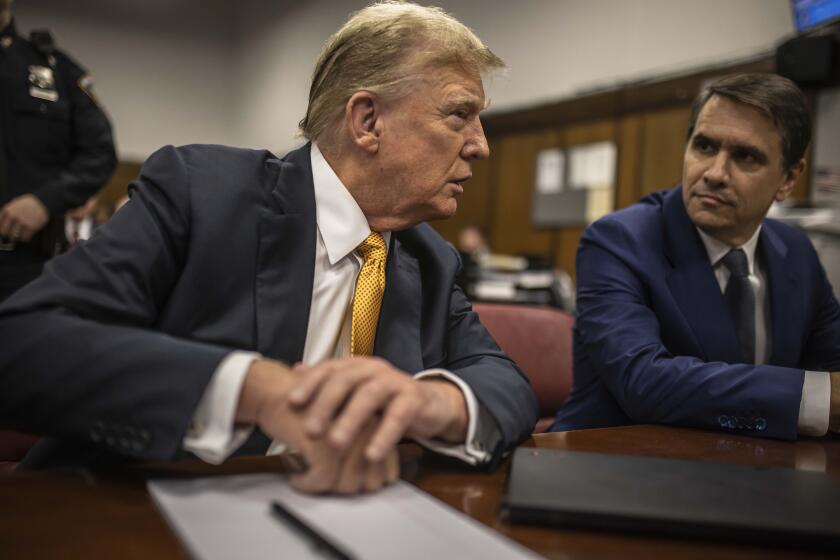 Former President Donald Trump sits in a courtroom next to his lawyer Todd Blanche before the start of the day's proceedings in the Manhattan Criminal court, Tuesday, May 21, 2024, in New York. (Dave Sanders/The New York Times via AP, Pool)