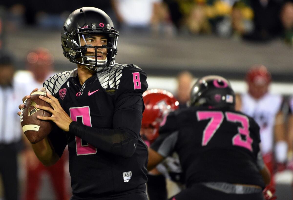 Oregon quarterback Marcus Mariota looks downfield during the first quarter of last Saturday's game against Arizona. The Ducks were upset by the Wildcats, 31-24.