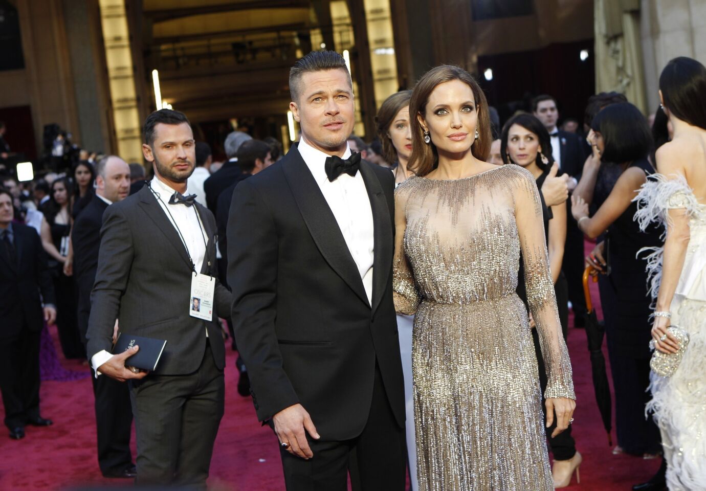 Brad Pitt and Angelina Jolie arrive at the 86th Academy Awards on March 2, 2014, at the Dolby Theatre in Hollywood.