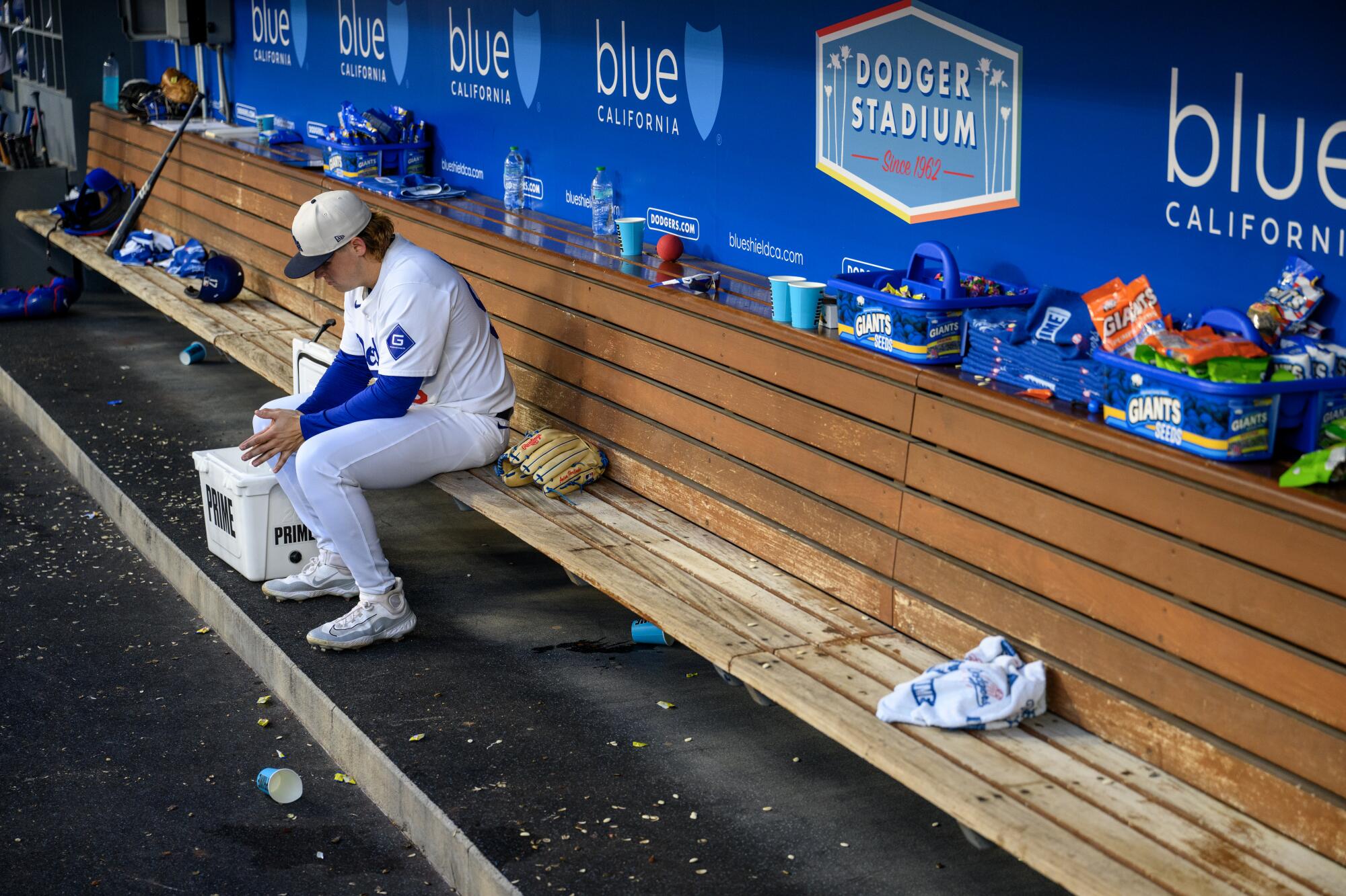 Dodgers starting pitcher Landon Knack sits alone in the dugout during the fourth inning Thursday.