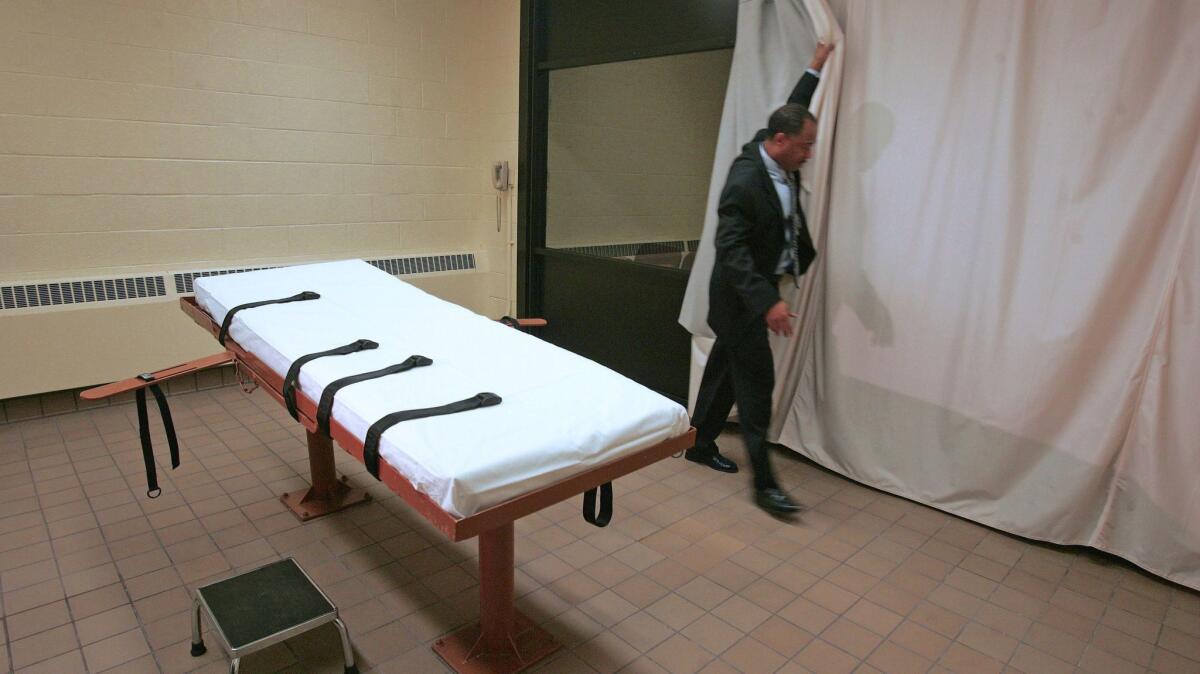 A curtain is pulled between the death chamber and witness room at the prison in Lucasville, Ohio. in Nov. of 2005.