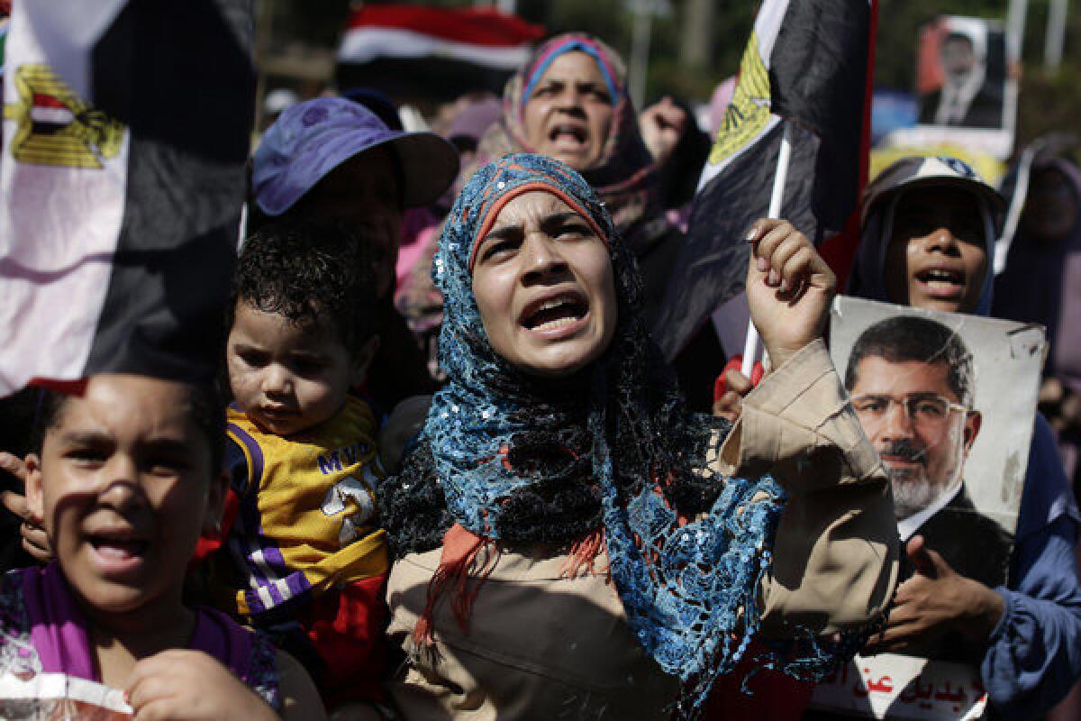 Supporters of Egypt's ousted President Mohammed Morsi chant slogans Saturday near the University of Cairo in Giza, Egypt.