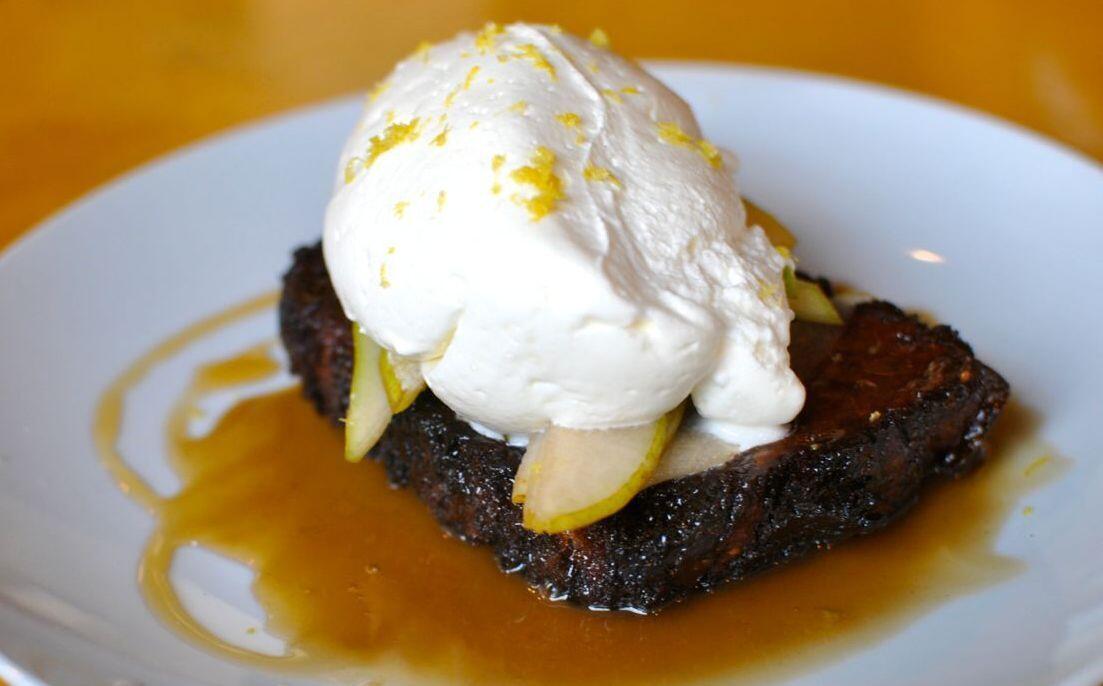 Capirotada toast on the brunch menu at Corazon y Miel, with pears and Chantilly cream.