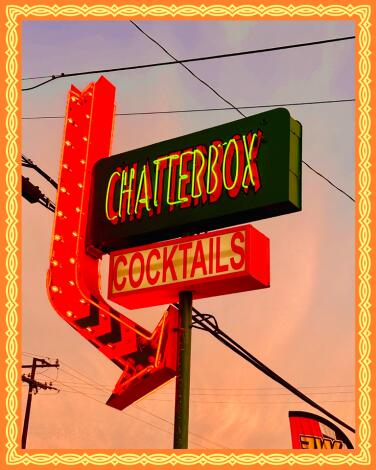 Neon sign that says "Chatterbox, cocktails"