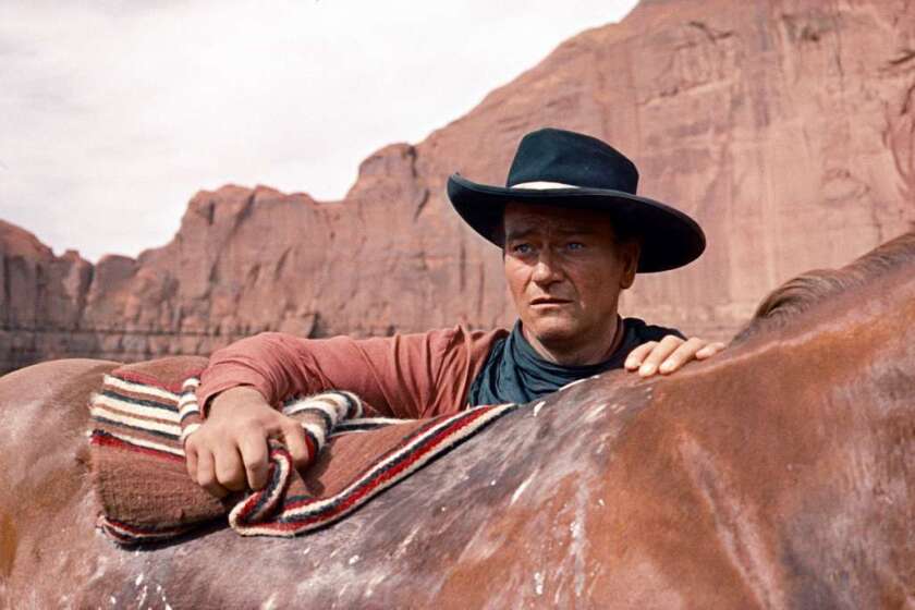 John Wayne stars in the classic western "The Searchers," directed by John Ford.