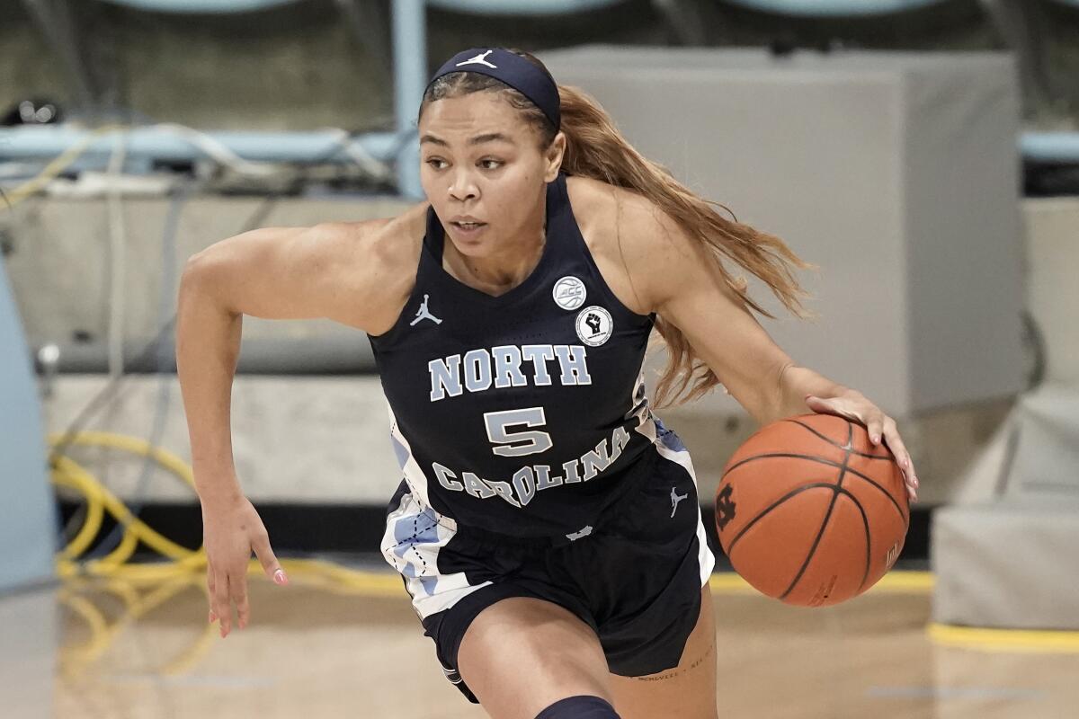 North Carolina guard Stephanie Watts drives.