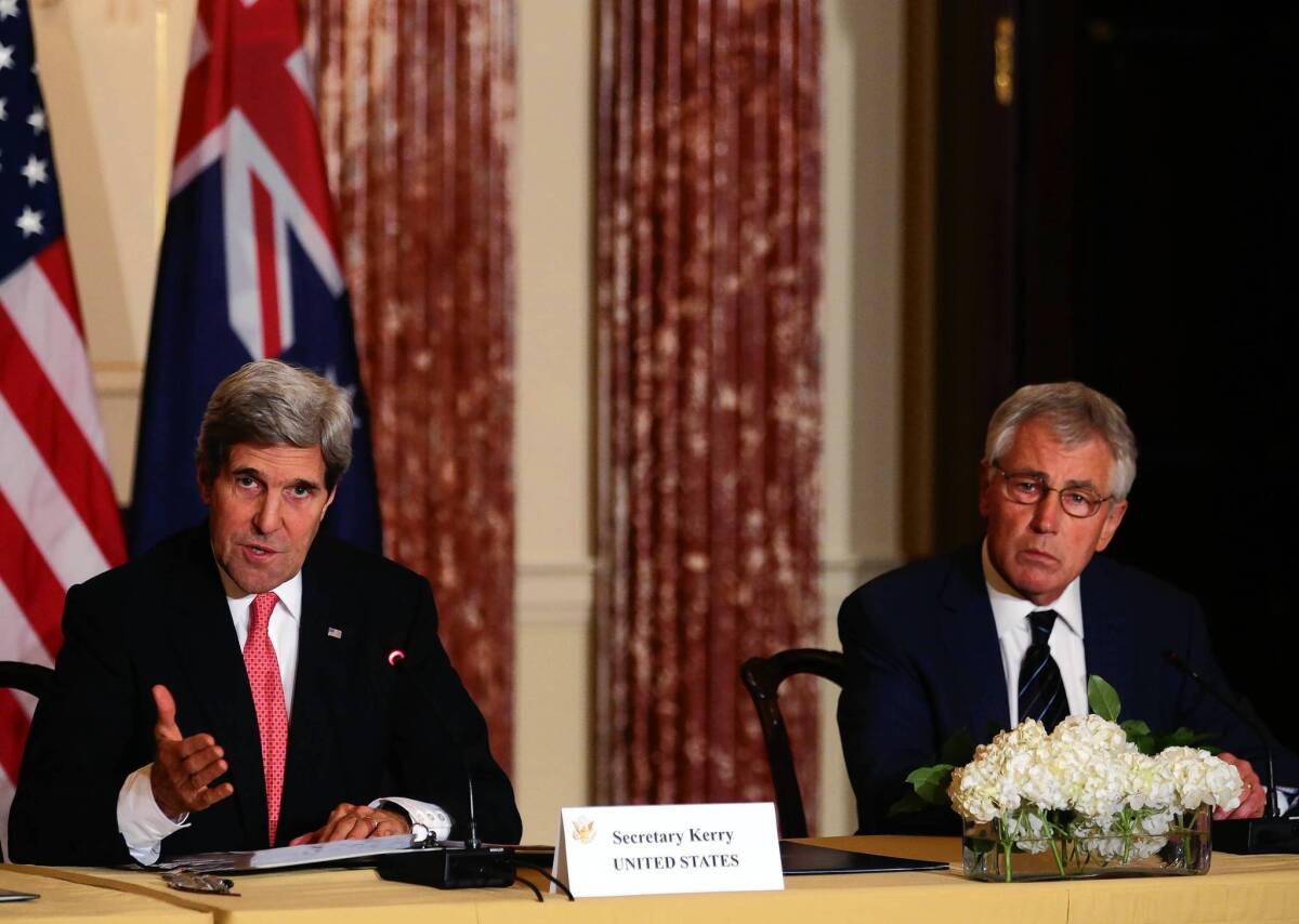 Secretary of State John F. Kerry, left, is joined by Defense Secretary Chuck Hagel at a news conference in Washington. Kerry said that the U.S. and Afghanistan had reached agreement on a security partnership after combat troops withdraw at the end of 2014.