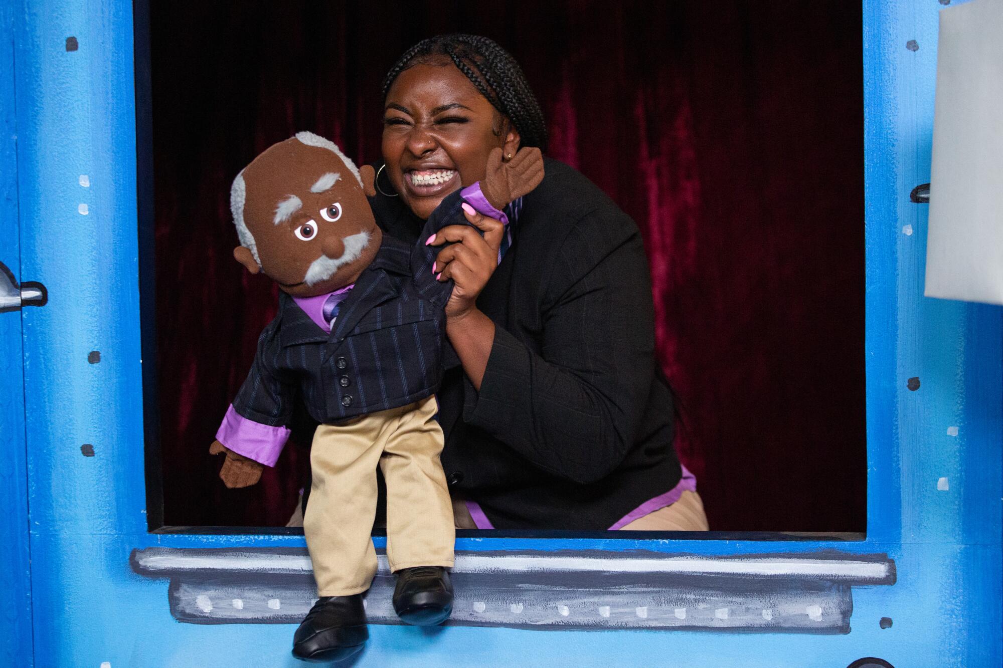 DaMya Gurley performs with a puppet