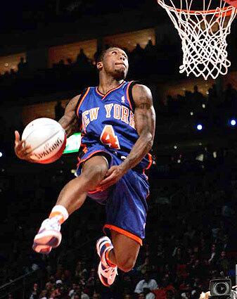 Knick guard Nate Robinson flies toward the basket during the Slam Dunk contest Saturday, which he won.
