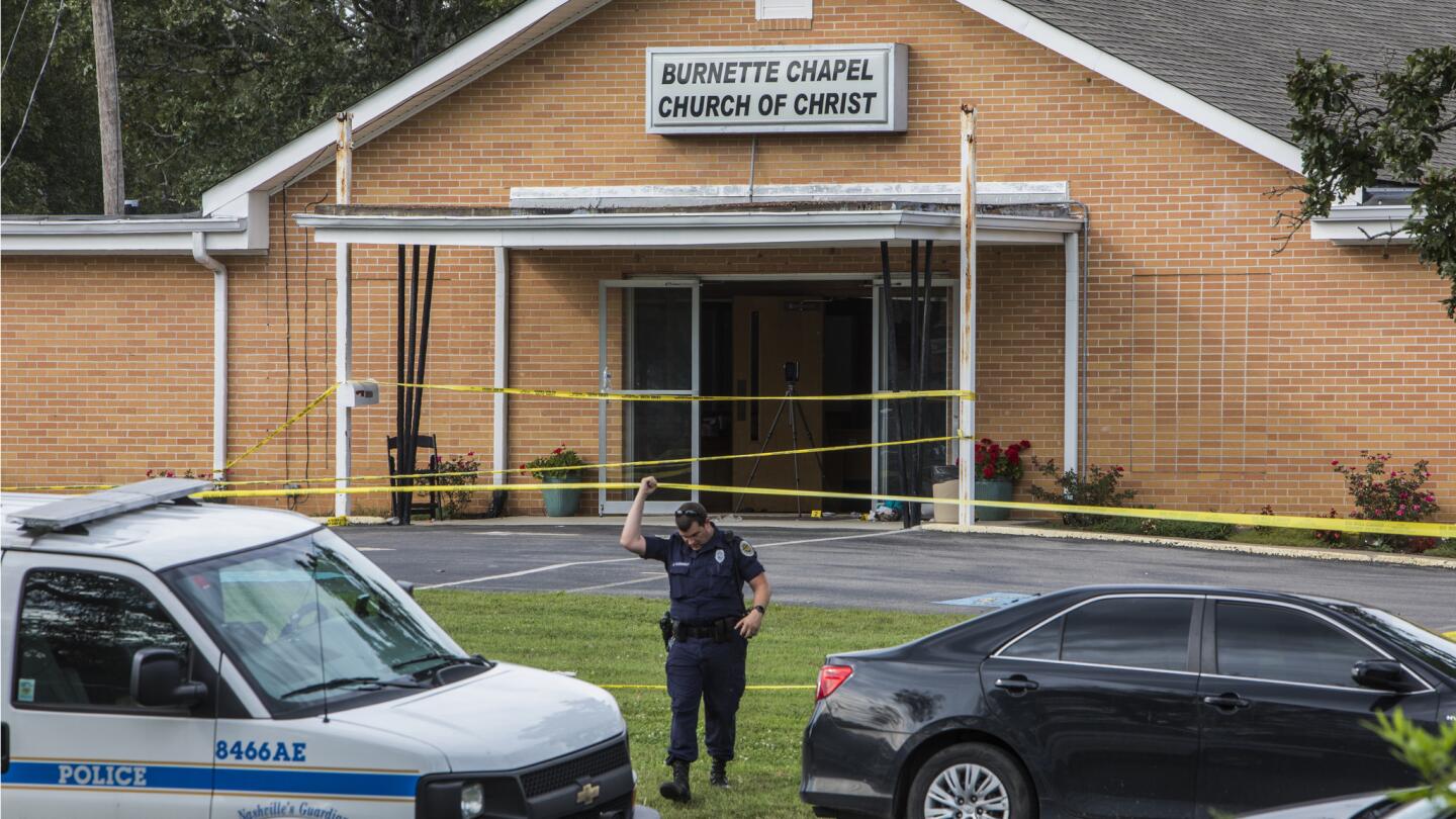 Law enforcement officials investigate the area around the Burnette Chapel Church of Christ in Antioch, Tenn.