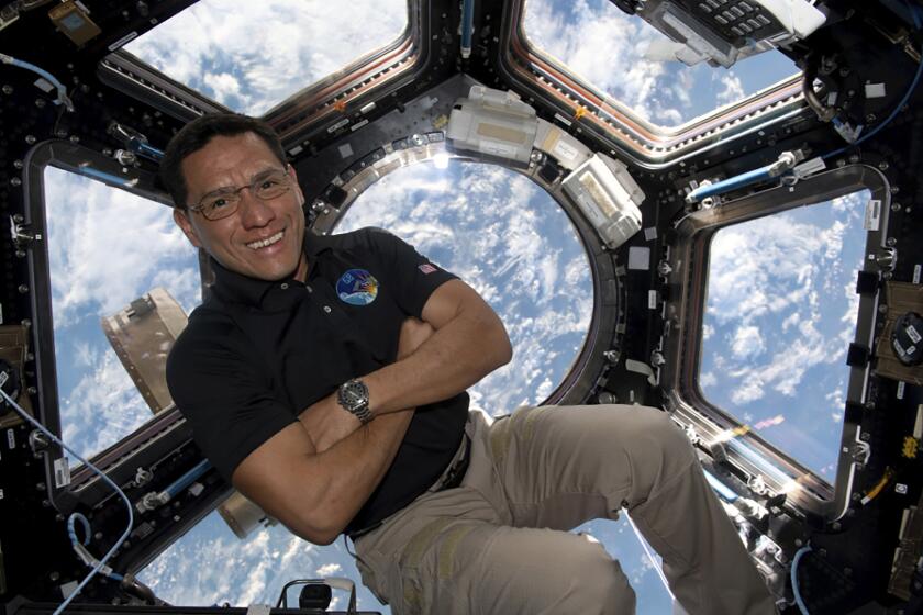 astronaut Frank Rubio floating inside the cupola, the International Space Station’s “window to the world.”