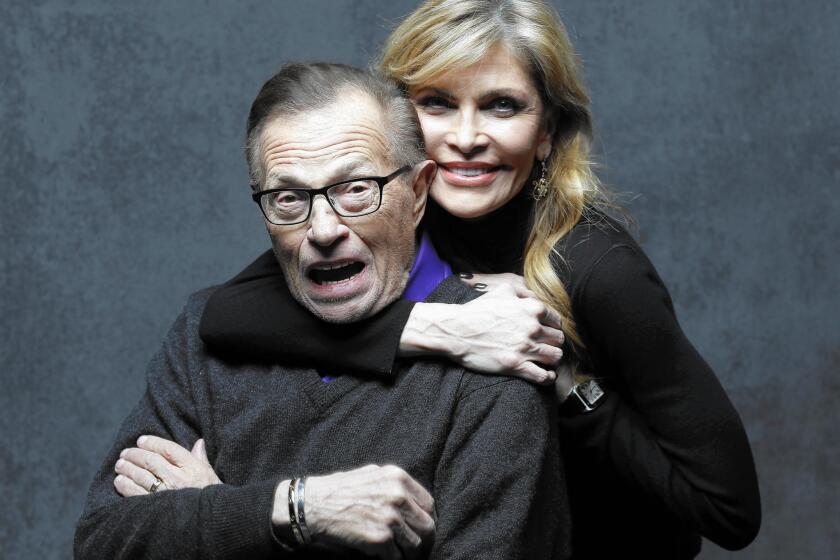 Larry King, pictured with his wife, Shawn, keeps his mind and body busy.