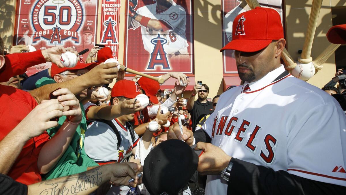 Albert Pujols gives Angles jersey to young fan after game