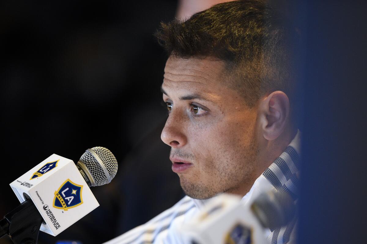 Los Angeles Galaxy's Javier "Chicharito" HernÃ(degrees)ndez answers questions from the media during a press conference in Carson, Calif., Thursday, Jan. 23, 2020. (AP Photo/Kelvin Kuo)