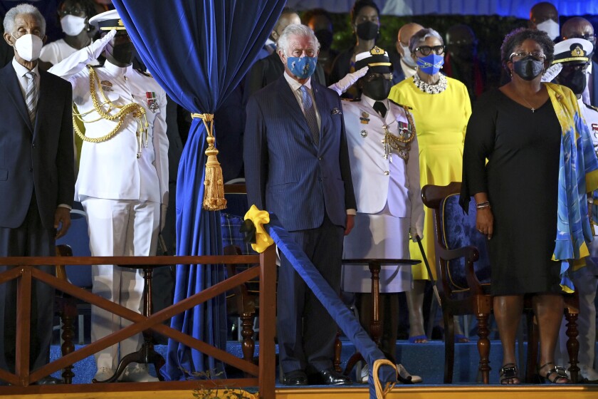 Barbados' new President Sandra Mason, center right, awards Prince Charles with the Order of Freedom of Barbados