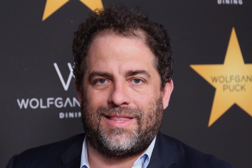FILE - In this April 26, 2017 file photo, Brett Ratner arrives at the Wolfgang Puck's Post-Hollywood Walk of Fame Star Ceremony Celebration in Beverly Hills, Calif. Ratner was accused by at least six women of sexual harassment. Playboy shelved projects with Ratner and Ratner stepped away from Warner Bros. related activities. He denies the allegations. (Photo by Willy Sanjuan/Invision/AP, File)