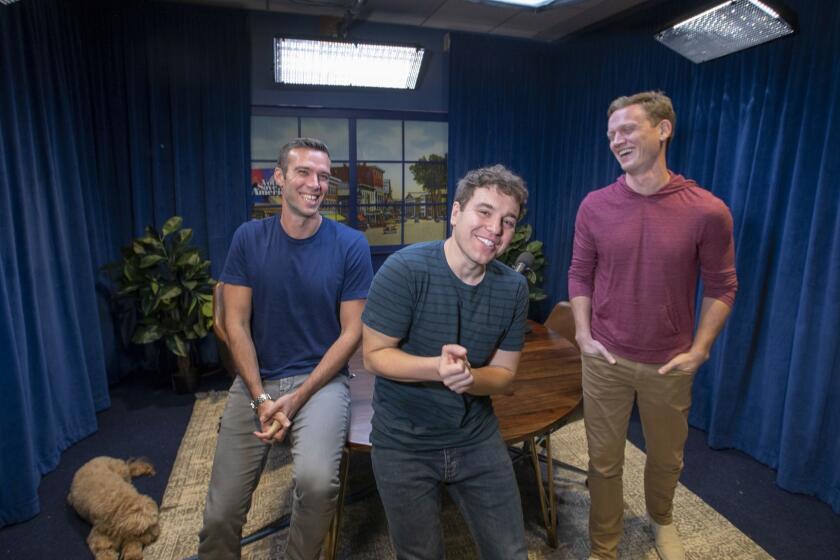 LOS ANGELES, CALIF. -- MONDAY, OCTOBER 8, 2018: Former White House staffers under President Obama Jon Favreau, left, Jon Lovett, center, and Tommy Vietor, right, (not pictured is Dan Pfeiffer,) hosts of the hit politics podcast 'Pod Save America,' arrives for a limited run of live shows time for the midterm elections on HBO Oct. 12. Photos taken at Crooked Media offices in Los Angeles, Calif., on Oct. 8, 2018. (Allen J. Schaben / Los Angeles Times)