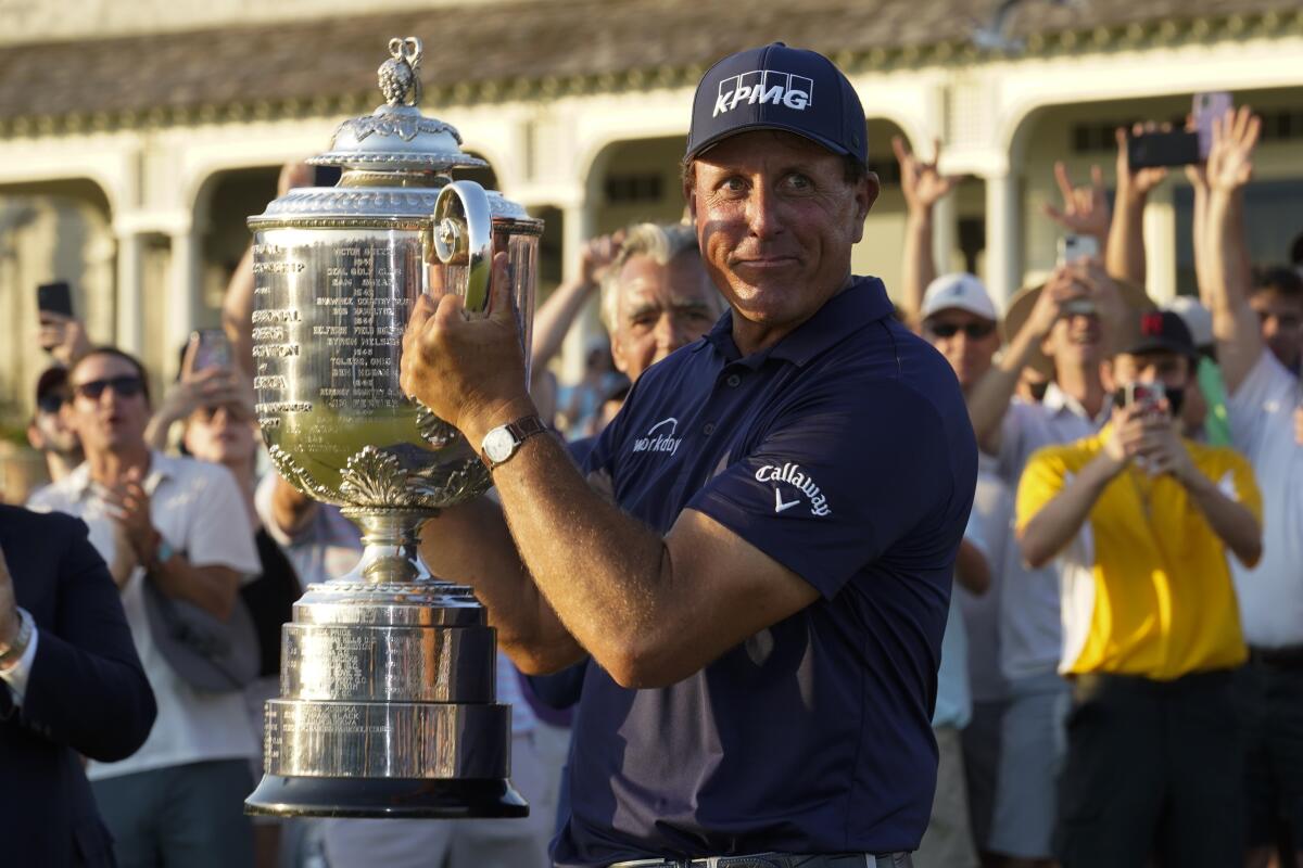 Phil Mickelson holds the Wanamaker Trophy after winning the PGA Championship on Sunday.