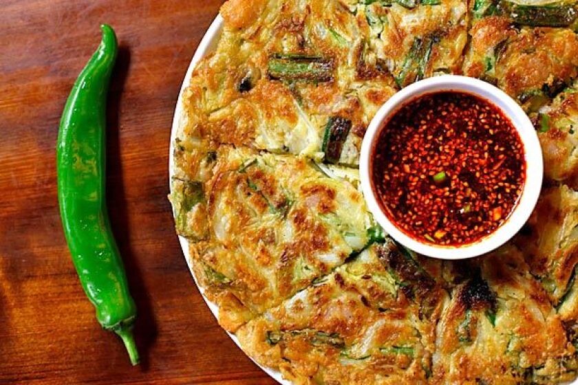 A seafood pancake at Jun Won in Koreatown comes with a chile sauce.