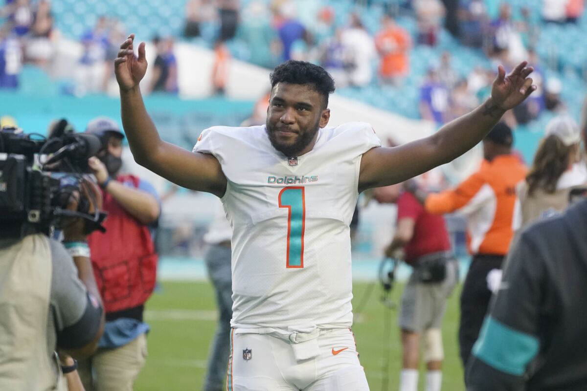 Miami Dolphins quarterback Tua Tagovailoa (1) gestures at the end of an NFL football game against the New York Giants, Sunday, Dec. 5, 2021, in Miami Gardens, Fla. The Dolphins defeated the Giants 20-9. (AP Photo/Wilfredo Lee)